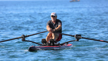 Load image into Gallery viewer, Man rowing with the ROWONAIR Dude 18&#39; Inflatable Paddle Board