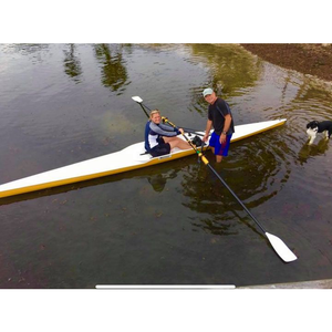 Boats - Man and Woman learning to drive a Little River Marine Cambridge Rowing Shell