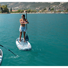Load image into Gallery viewer, Inflatable Stand Up Paddleboard - Woman paddling with the Aqua Marina City Loop 10&#39;2&quot; Inflatable Stand Up Paddle Board 