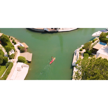 Load image into Gallery viewer, Inflatable Stand Up Paddle Board - Man paddling on calm water with the Aqua Marina Race Elite 14’0″ Inflatable Stand Up Paddle Board