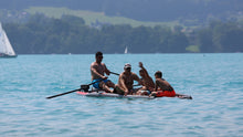 Load image into Gallery viewer, Four People boarding on the ROWONAIR iCoaster 18&#39; Inflatable Rowing Board