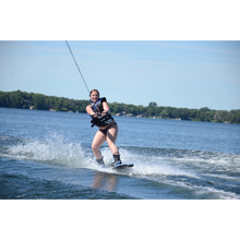 Load image into Gallery viewer, A woman using the Rave Freestyle Blue Wakeboard with RAVE boots