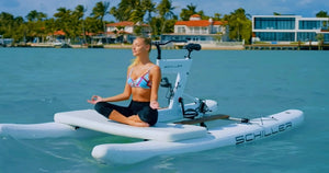 Woman having Yoga session on a Schiller Bikes S1-C Front Deck attached to the Schiller S1-C Water Bike