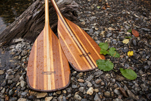 Merrimack Canoes Gunflint Canoe Paddle at the side of a lake