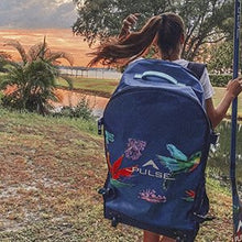 Load image into Gallery viewer, A girl wearing Pulse The Honey 10&#39;6&quot; Backpack and holding Pulse Paddle