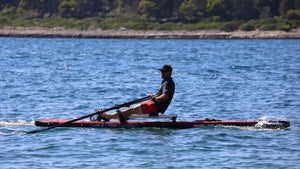 Man rowing on Lite 15' with ROWONAIR RowMotion Universal Rowing Unit