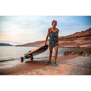 Woman smiling while holding Yujet Surfer Electric Jetboard EJB-01 with wheels  with wheels