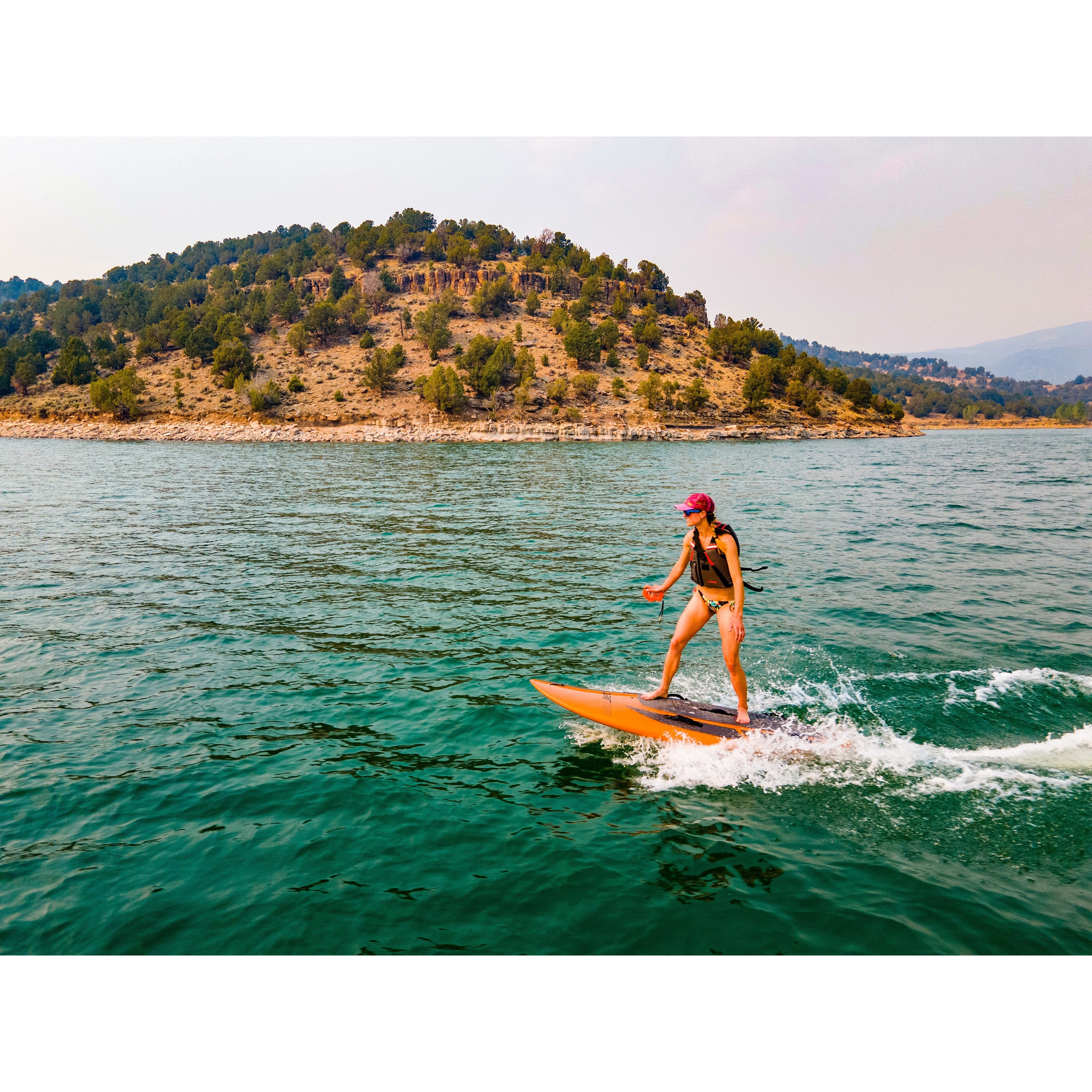 Woman riding  Yujet Electric Surfobard EJB-01