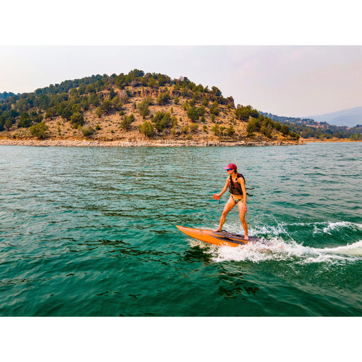 Woman riding  Yujet Electric Surfobard EJB-01
