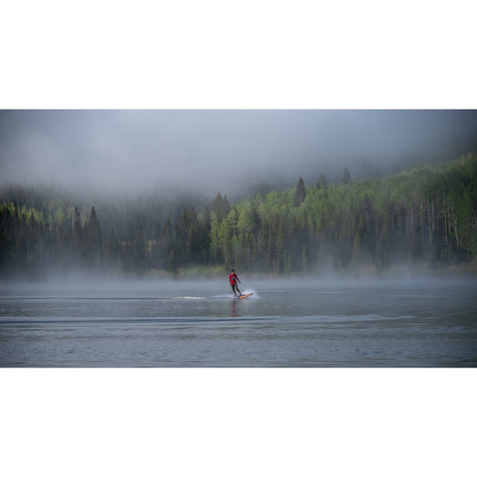 Man riding Yujet Electric Surfobard EJB-01 in middle of the Lake