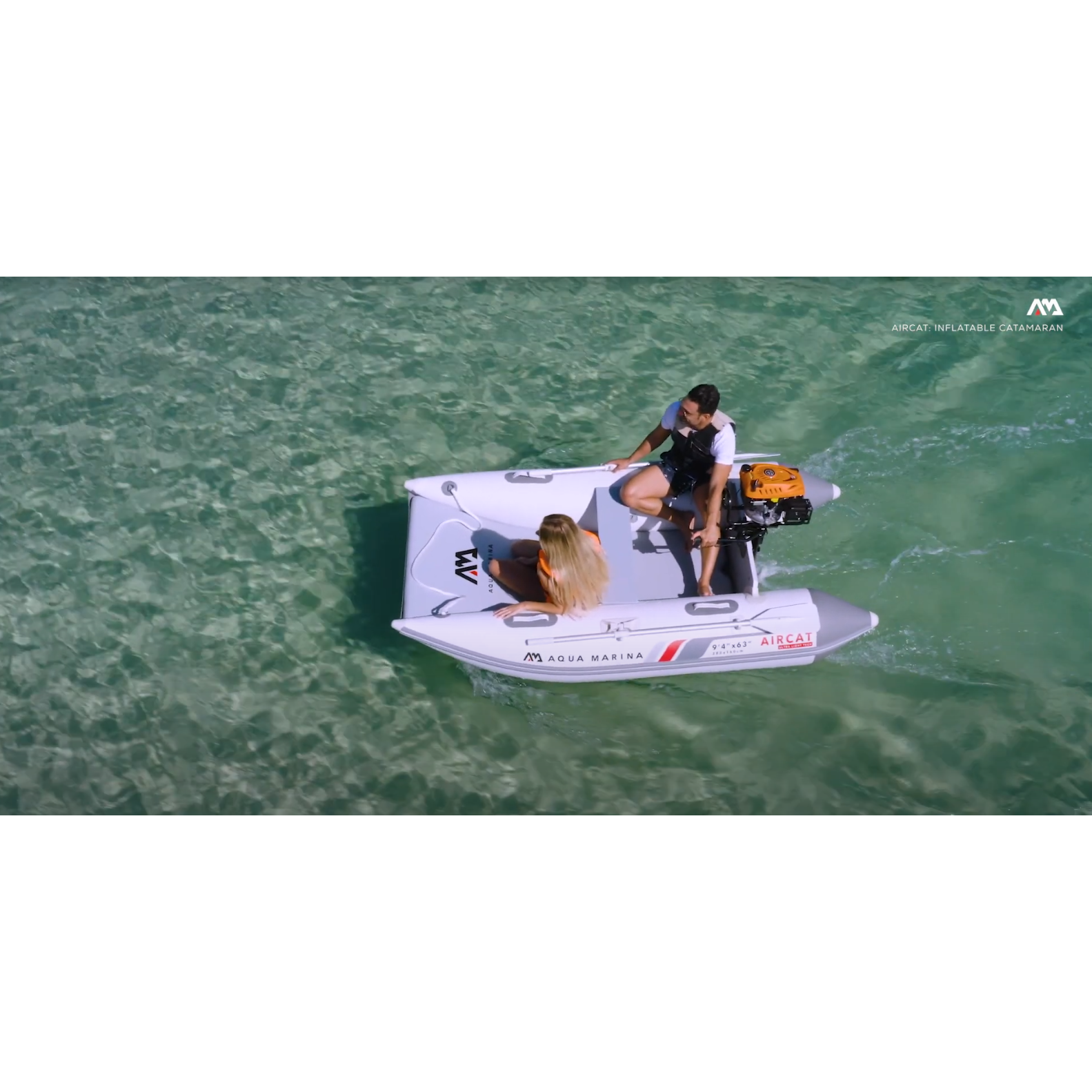 Boat - Man and Woman riding a Aqua Marina The Aircat Catamaran BT-AC335 with motor