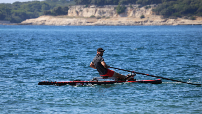 Man rowing on the ROWONAIR Lite 15' Inflatable Paddle Board