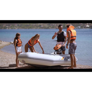 Inflatable boat - Men and Woman with child preparing the Aqua Marina Deluxe U-Type Yacht Tender 11’6″ (350cm) with DWF Air Deck BT-UD350 on the shore