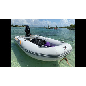 Inflatable boat - Aqua Marina Deluxe U-Type Yacht Tender 11’6″ (350cm) with DWF Air Deck BT-UD350 with motor attached set on the water