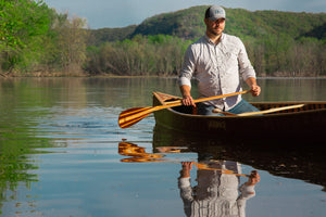 Man canoeing with the Merrimack Canoes Nessmuk Canoe Paddle