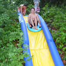 Load image into Gallery viewer, A boy riding on the Rave Sports Turbo Chute - Lake Package