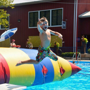 A child jumping in the WaterBlob® Classic Blob®