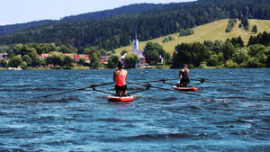 Women rowing with the ROWONAIR RowMotion Universal Rowing Unit