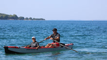 Load image into Gallery viewer, Man rowing on AirKayak 16&#39; with passenger with the ROWONAIR RowVista Universal Rowing Unit