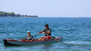 Man rowing on AirKayak 16' with passenger with the ROWONAIR RowVista Universal Rowing Unit