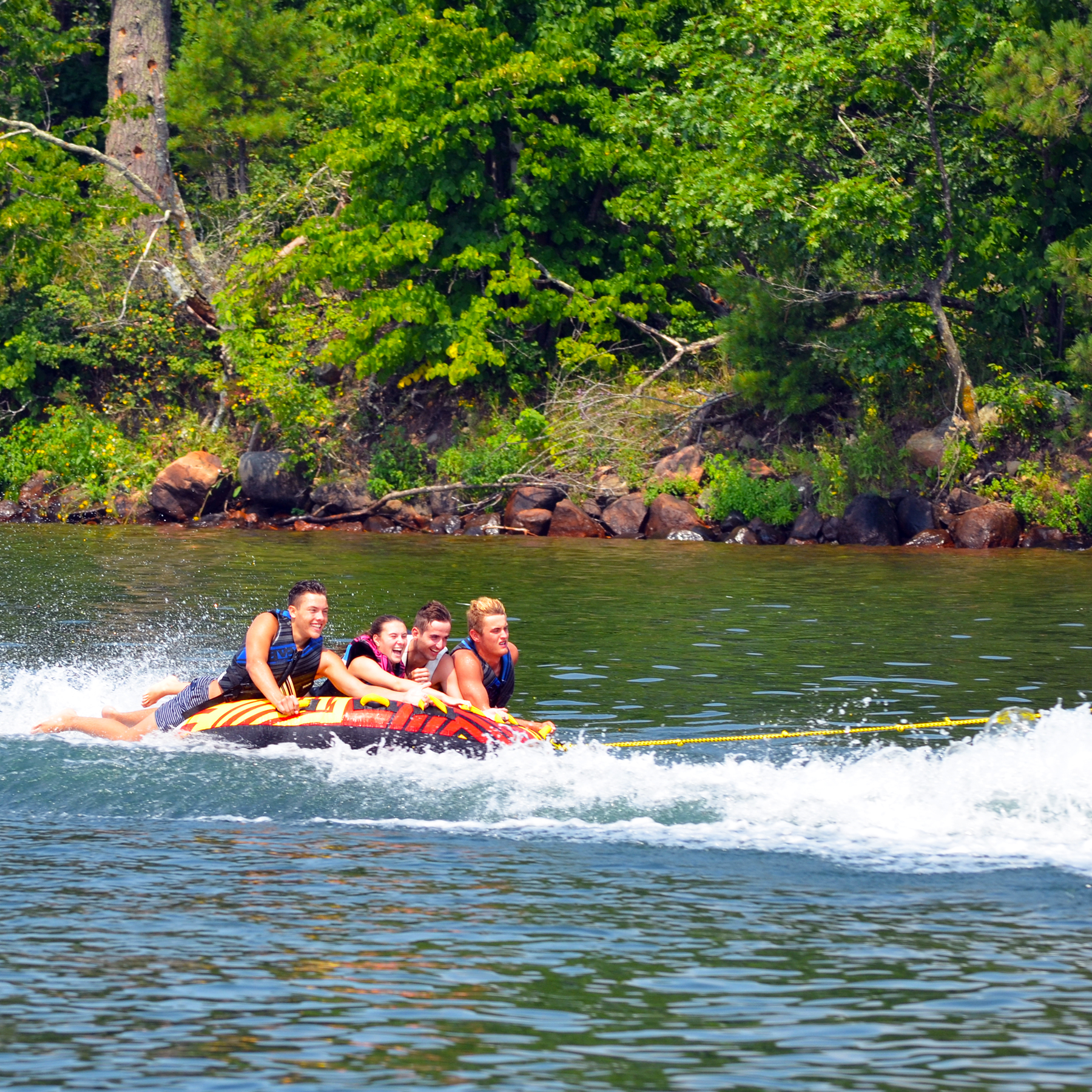Rave Rush 4P Towable Tube being towed with 4 people riding on it