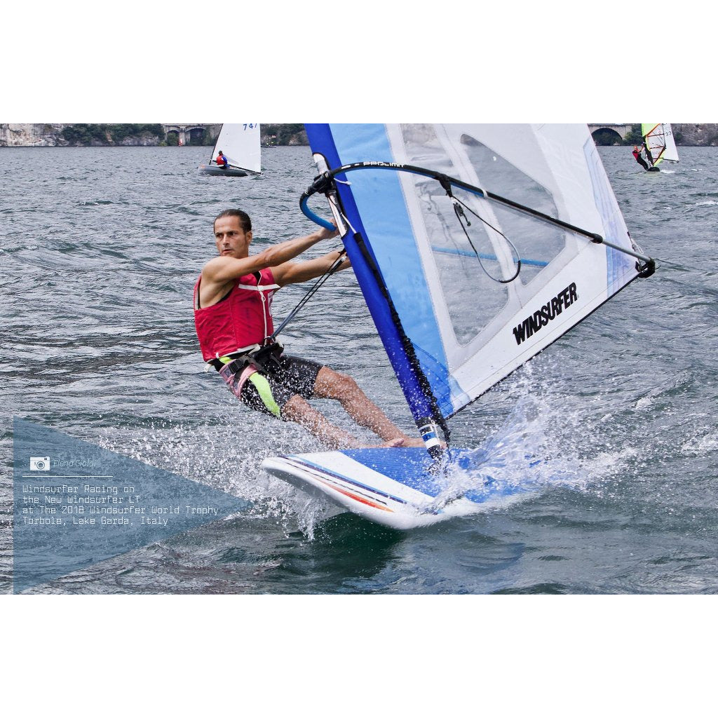 Windsurf Board -Man windsurfing with the Aerotech Sails 2021 Windsurfer LT School Windsurf Board on a clear and sunny day