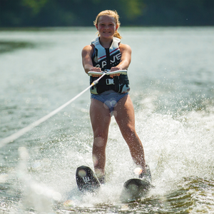 A girl skiing using Rave Shredder Combo Water Skis