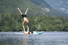 Load image into Gallery viewer, Two Men Performing Acrobatics On A SipaBoards Inflatable Paddleboards