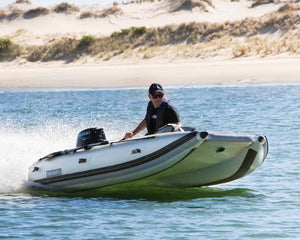Man riding the Takacat T340LX Inflatable Boat