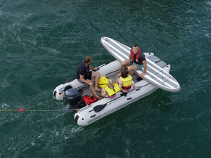 Men and kids riding the Takacat T340LX Inflatable Boat