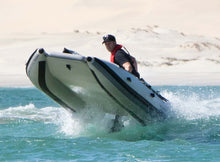 Load image into Gallery viewer, Man on board the Takacat T460LX Inflatable Boat