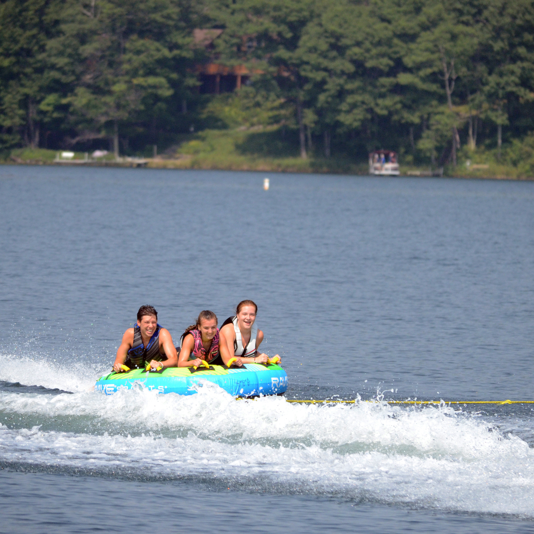 Rave The Goat 3P Towable Tube being towed with 3 people riding on it