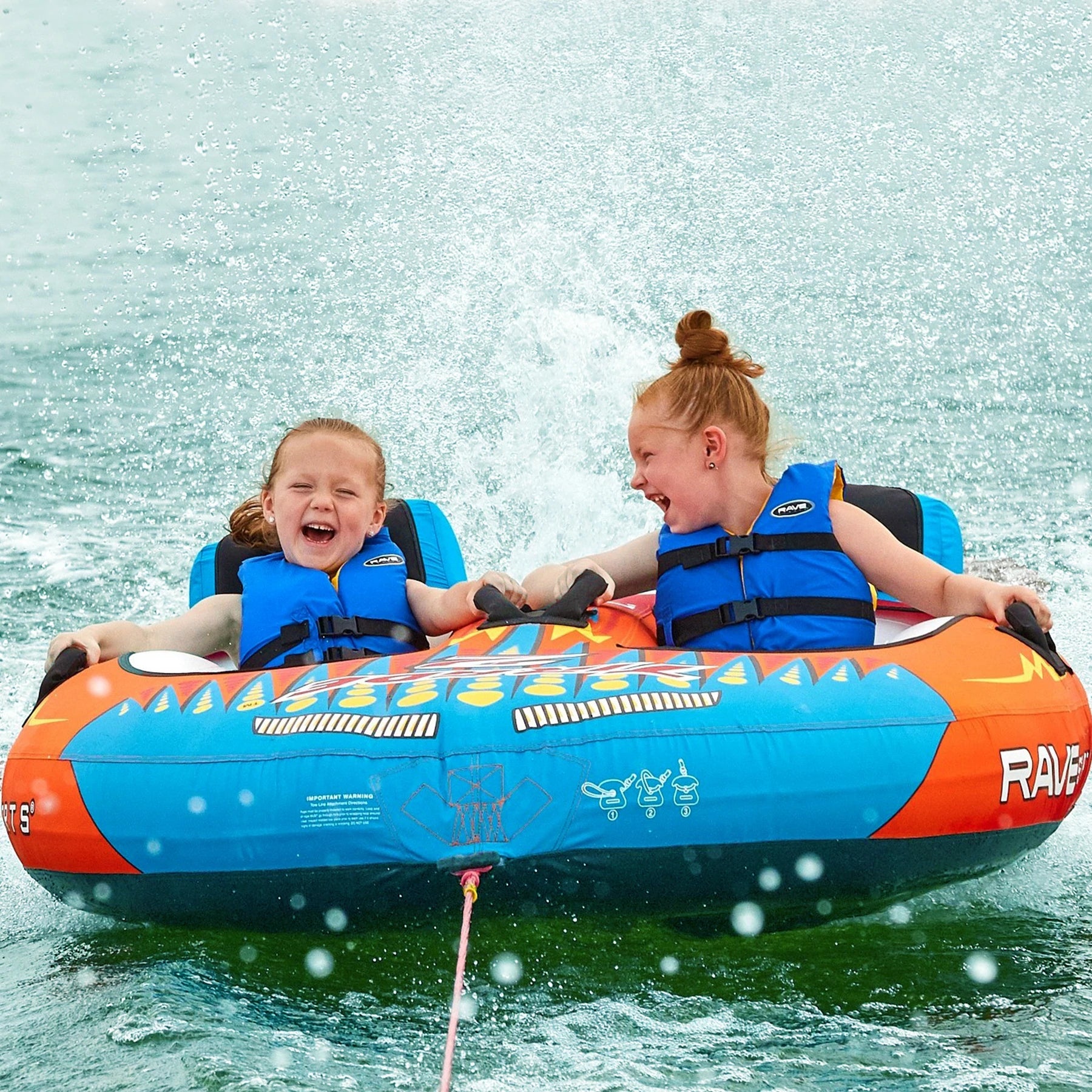 Two kids enjoying the Rave Sports Tirade II Towables 02371