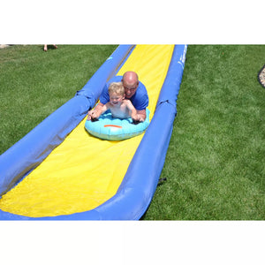 toddler and his dad riding the turbo water sled sliding in the Rave Sports 116' Turbo Chute Package 02971-12