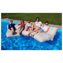 Load image into Gallery viewer, People sitting on the YachtBeach Air Sofa 5&#39;x5&#39;x2&#39; in the pool