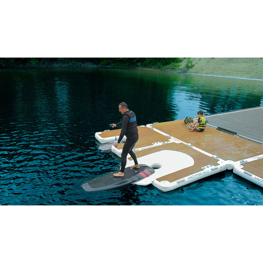 Man launching his foil from the YachtBeach Foil Dock Single 2.05 
