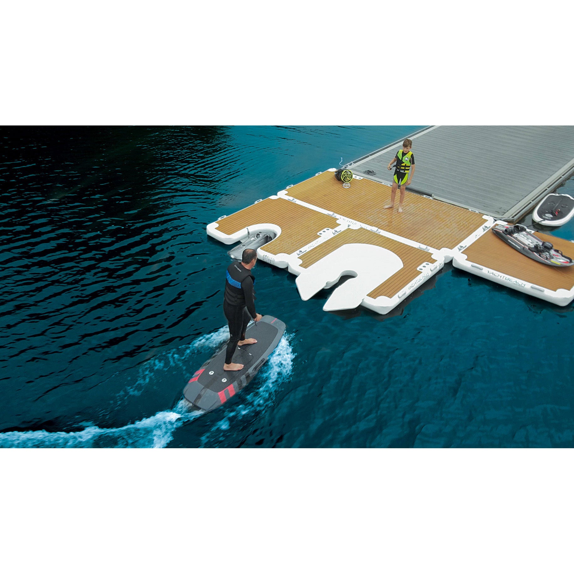 Man boarding his foil onto the YachtBeach Foil Dock Single 2.05 