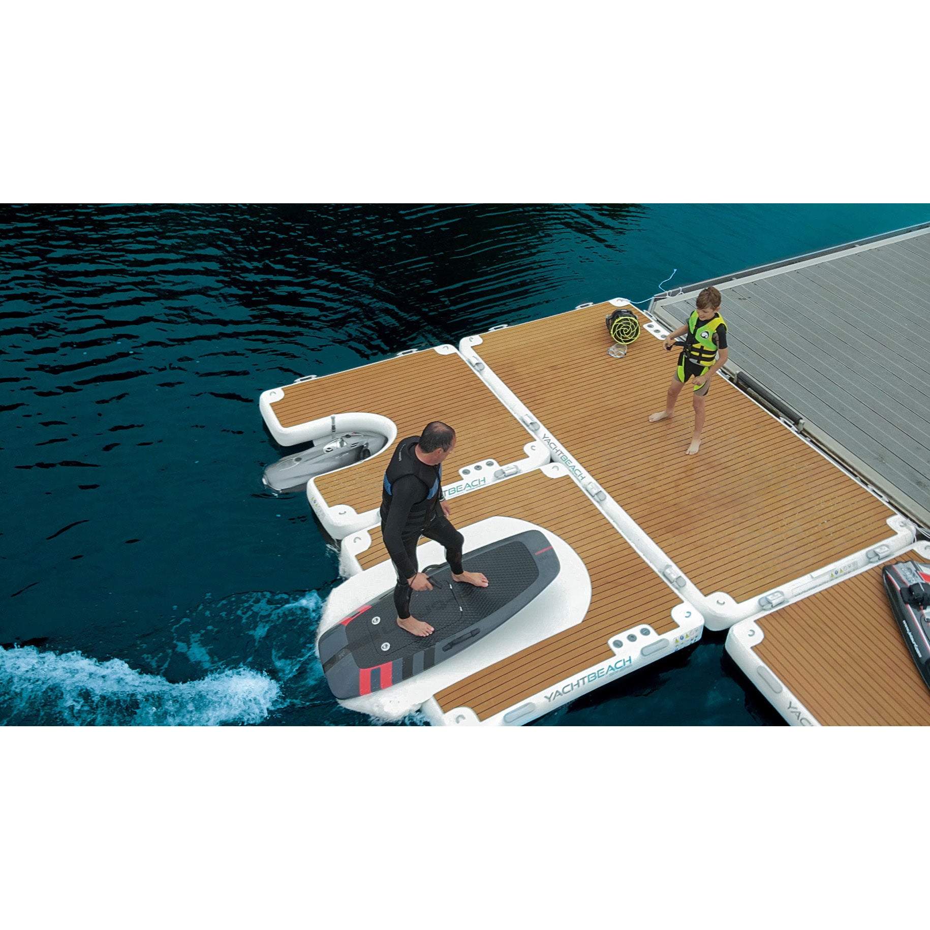 Man boarding his foil onto the YachtBeach Foil Dock Single 2.05 
