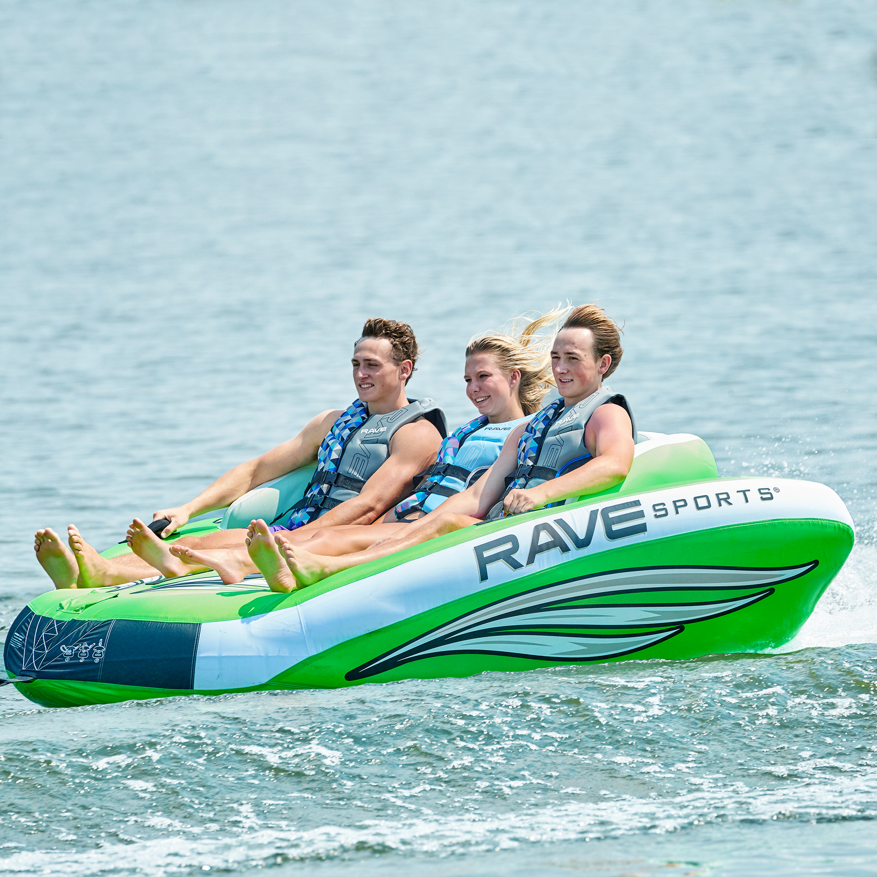 Rave Wake Hawk Towable Tube being towed with 3 people riding it