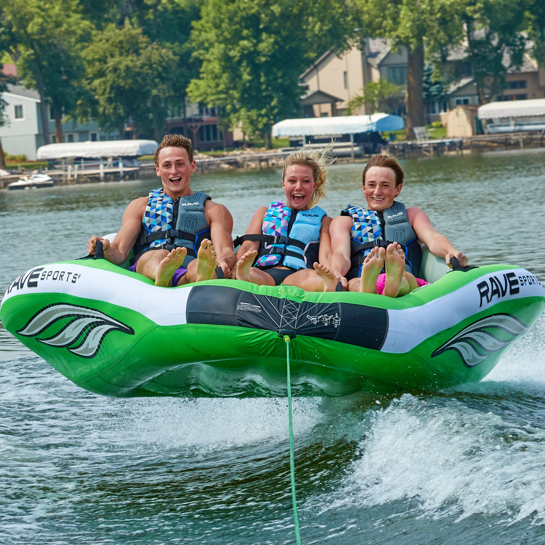 Rave Wake Hawk Towable Tube being towed with 3 people riding it