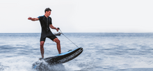 Load image into Gallery viewer, A man rides the WaveShark Electric JetBoard.
