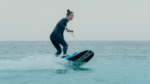 A woman rides the WaveShark Electric JetBoard.