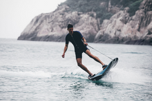 Load image into Gallery viewer, A man rides the WaveShark Electric JetBoard.