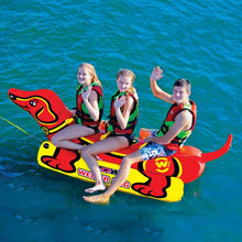 Load image into Gallery viewer, WOW Weiner Dog 3 Towable Tube being towed with 3 people riding on it